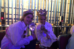 Two duchesses next to each other smiling at the camera