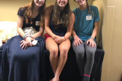 Three duchesses sitting down smiling at the camera
